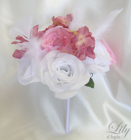 are made with one white rosebud accented with mauve hydrangeas